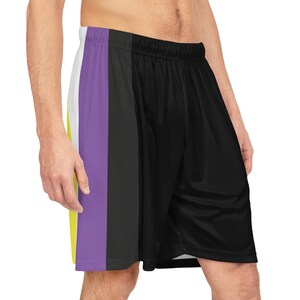 May include: Black athletic shorts with a purple, white, and yellow stripe down the side.