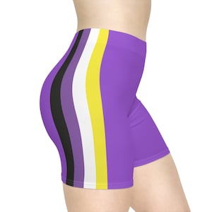 May include: Purple athletic shorts with a black, purple, white, and yellow stripe down the side.