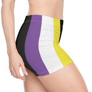 May include: Black, purple, white, and yellow striped athletic shorts. The shorts are made of a stretchy, comfortable fabric and are perfect for working out or just lounging around.