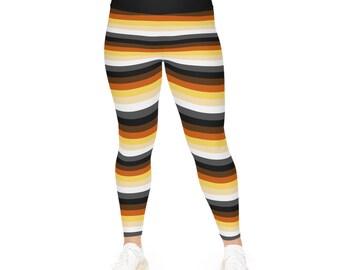May include: Black, brown, tan, and white striped leggings. The leggings have a high waist and are made of a stretchy material.