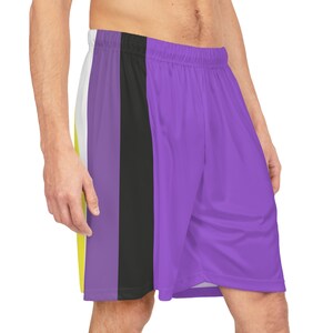 May include: Purple, black, and yellow athletic shorts with a side stripe design.