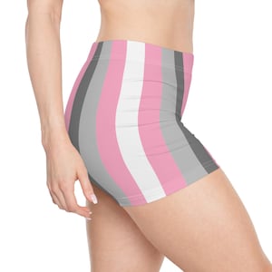 May include: Pink, white, gray, and dark gray striped shorts. The shorts are form-fitting and have a high waist. The stripes run vertically down the shorts.
