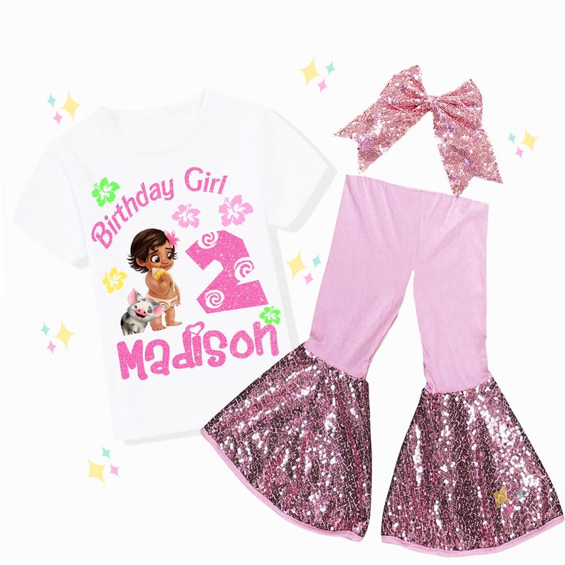 May include: A white t-shirt with a graphic of a cartoon girl and pig, the text "Birthday Girl", the number "2", and the name "Madison" in pink. The outfit includes pink pants with sequined bell bottoms and a pink sequined bow.