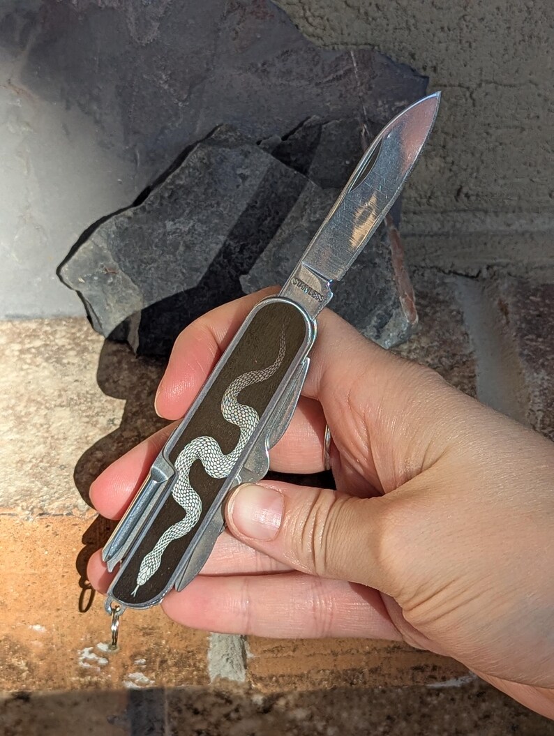 pocket knife with a snake design