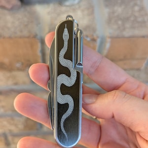 snake engraved utility knife