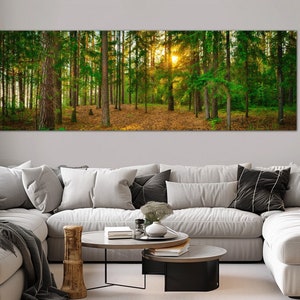 May include: A panoramic photograph of a lush green forest with tall trees and sunlight filtering through the canopy. The forest floor is covered in fallen leaves and the air is filled with a sense of peace and tranquility.