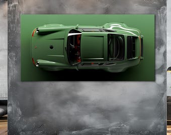 May include: An overhead view of a green vintage car print on a green background. The car has a sleek design with visible windows and red interior details. The artwork is mounted on a gray concrete wall above a wooden floor.