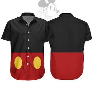 May include: Black button-down shirt with red lower section and two yellow oval shapes. The shirt's design is reminiscent of a famous cartoon character. The back of the shirt is also black and red.