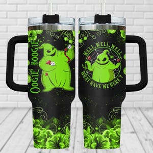 May include: A black and green stainless steel tumbler with a handle. The tumbler features a green character with a spider web and the text "Well, well, well... What have we here?" on one side and the text "Oogie Boogie" on the other side.