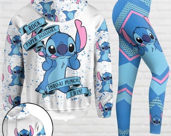 May include: White hoodie with a blue cartoon character and the text "Rock, Paper, Scissors, Throat Punch, I Win!"  The hoodie has a blue and white pattern with the same cartoon character.  A pair of blue leggings with a white and pink geometric pattern and the same cartoon character.