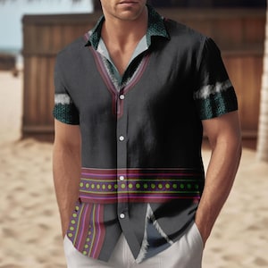 May include: Black button-down shirt with a unique design. The shirt features a patterned collar and sleeve cuffs, along with a decorative band across the chest. The design incorporates shades of green, red, purple, and white.