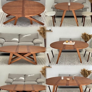 May include: A round wooden dining table with a smooth, medium-brown finish and a distinct central panel. The table features four angled, intersecting legs that provide a stable base. The surface is flat and circular, showcasing a natural wood grain.