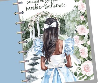 May include: A watercolor illustration of a girl in a blue dress with a white bow in her hair. She is walking through a garden with white and pink roses. The text "Dancing on the edge of make-believe." is at the top of the image.