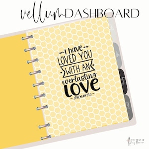 May include: A yellow and white planner with a honeycomb pattern and the text "I have loved you with an everlasting love - Jeremiah 31:3" in black.