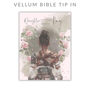 May include: A vellum bible tip-in featuring a watercolor illustration of a person seen from behind with hair in a bun, wearing armor and white wraps. The text reads Daughter of the King and 2 Corinthians 6:18, surrounded by pink roses.