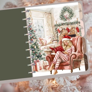 May include: Watercolor illustration of a woman in red and white striped pajamas and a Santa hat reading a book by a fireplace. A Christmas tree and gifts are in the background. The image is part of a planner with labeled tabs.