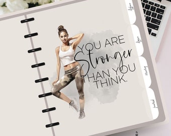 May include: A motivational planner cover with a watercolor background featuring a woman in athletic wear. The text reads "You are stronger than you think."