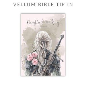May include: A vellum bible tip-in featuring a watercolor illustration of a person with long blonde hair seen from behind, wearing dark armor with pink roses. The text reads Daughter of the King and 2 CORINTHIANS 6:18. A sword is strapped to the back.