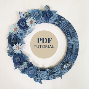 May include: A denim wreath decorated with blue fabric flowers, butterflies, and a PDF tutorial sign.