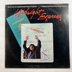 May include: A vintage vinyl record album cover for the "Midnight Express" soundtrack. The cover features a passport and a document with the word "CANCELLED" stamped on it. The album title is in red script, and the background is black.