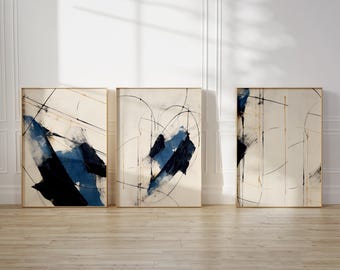 May include: Three abstract paintings in wooden frames. Each painting features a white background with black and blue abstract shapes and lines.