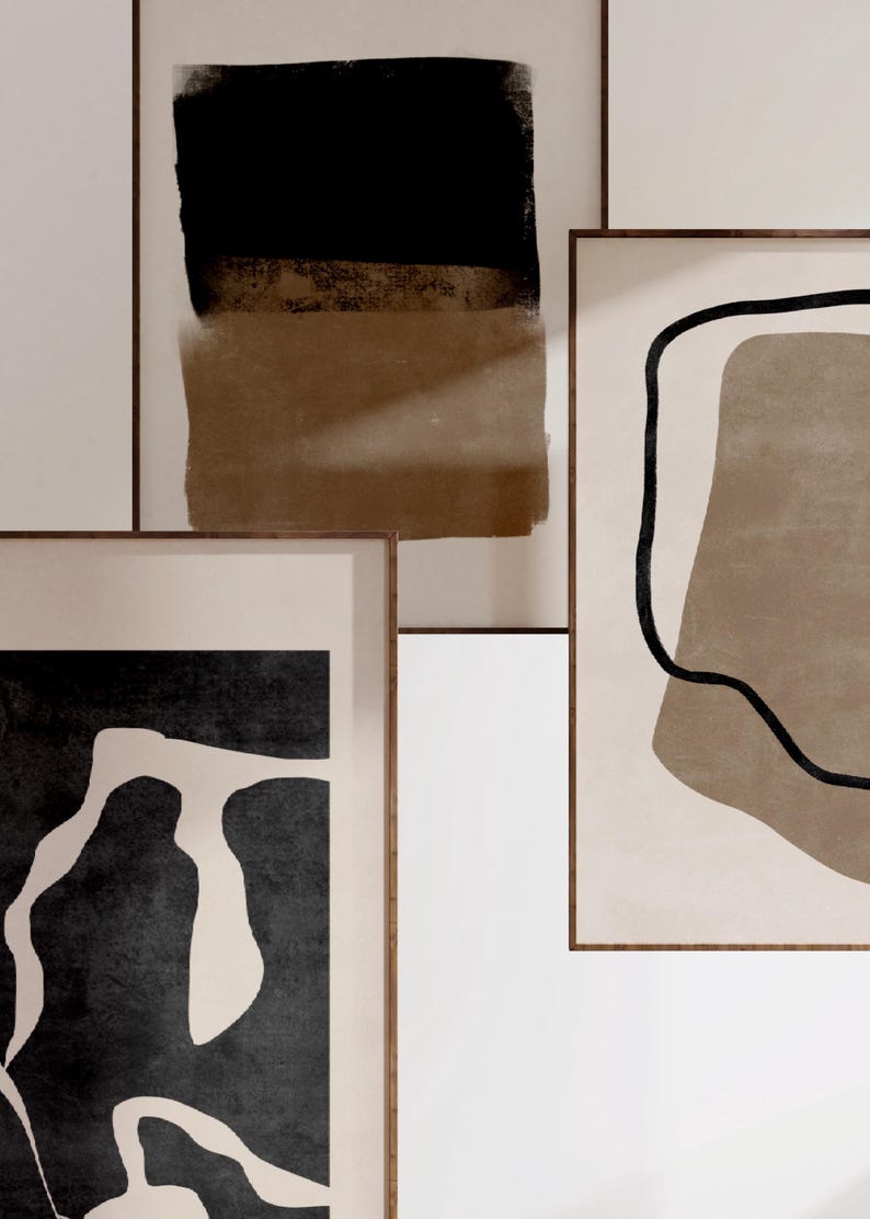May include: Three framed abstract art prints with brown and black geometric shapes and lines on a white background.