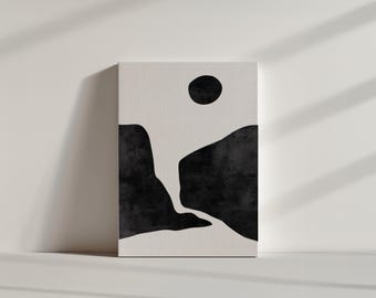 May include: Abstract black and white art print featuring a stylized landscape with a large circle in the top center. The landscape is made up of two black shapes that resemble mountains with a river flowing between them.