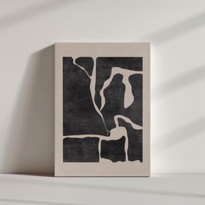 May include: Abstract art print with a black and white design of organic shapes. The print is on a beige background.