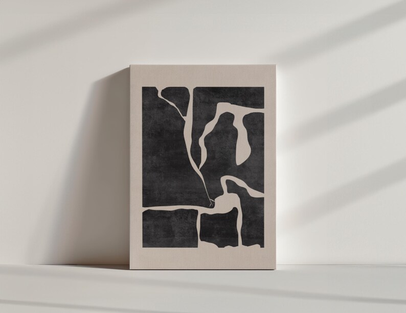 May include: Abstract art print with a black and white design of organic shapes. The print is on a beige background.