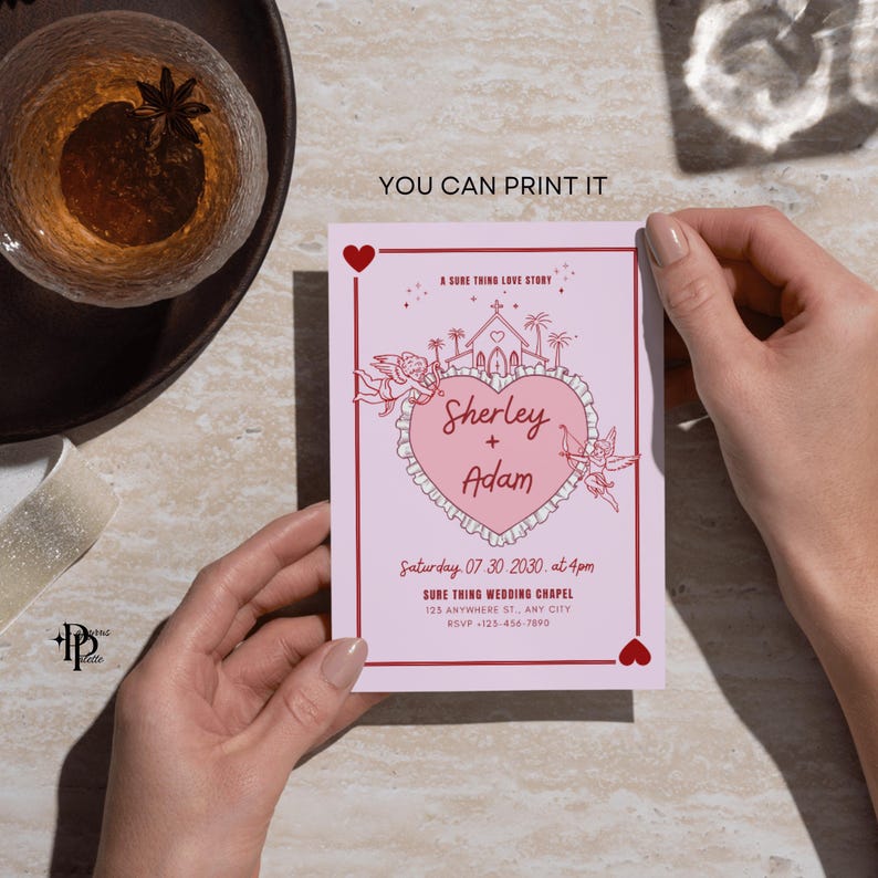 May include: A pink wedding invitation with a heart-shaped design featuring the names "Sherley + Adam." The invitation includes the text "A Sure Thing Love Story" and "You Can Print It." The date and time are also included.