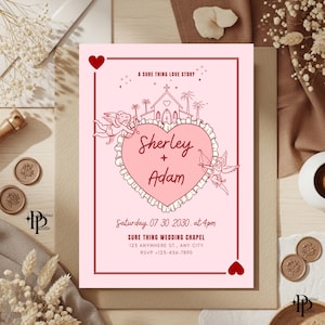 May include: A pink wedding invitation with a red border and heart accents. The invitation features a heart-shaped design with the names "Sherley + Adam" and the text "A Sure Thing Love Story". Includes wedding details.