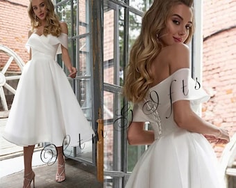 Chic Elegance Off-The-Shoulder Lace Wedding Dress with Pleated Organza and Tea-Length Bridal Style
