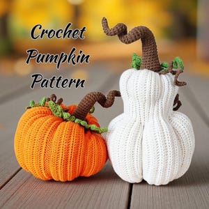 May include: Two crochet pumpkins, one orange and one white, with brown stems and green leaves. The orange pumpkin is on the left, and the white pumpkin is on the right. The text "Crochet Pumpkin Pattern" is above the pumpkins.