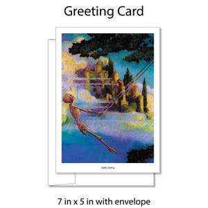 May include: Greeting card featuring a whimsical illustration of a skeleton swinging in front of a castle. The artwork is set against a backdrop of clouds and a blue sky. The card measures 7 x 5 inches and includes an envelope.