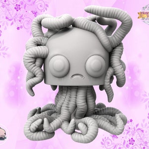 May include: A grey 3D printed figurine of a creature with multiple tentacles and large eyes. The creature has a sad expression and is sitting on a pink background.