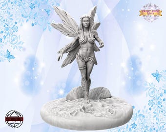 May include: A white, detailed miniature figurine of a fairy with wings, standing on a circular base. The fairy has long hair, a flowing dress, and a delicate face.