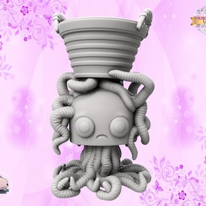 May include: A grey 3D printed figurine of a creature with a bucket on its head and tentacles. The creature has large eyes and a sad expression. The figurine is set against a pink background with floral designs.