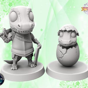 Puede incluir: Una miniatura en 3D impresa en gris de un pequeño dinosaurio blindado sosteniendo una espada, y una miniatura en 3D impresa en gris de un pequeño dinosaurio saliendo de un huevo.