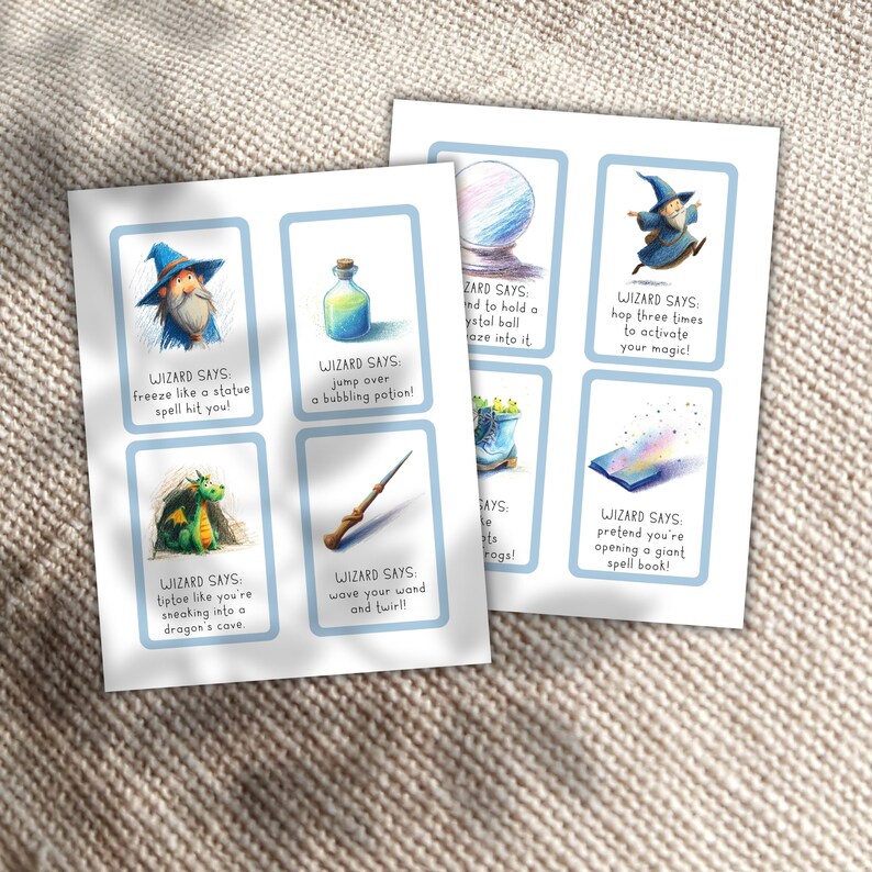 May include: Two printed sheets of cards with a light blue border. Each card features a wizard-themed illustration and text. The cards include images of a wizard, potion, crystal ball, wand, dragon, and spell book. The text reads "Wizard Says" followed by instructions.