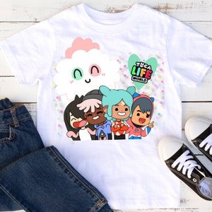 May include: White t-shirt with a colorful graphic of four cartoon characters and a cloud. The characters are smiling and have different colored hair and clothing. The text "T&CA LIFE WORLD" is in a heart shape above the characters.