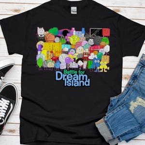 May include: Black t-shirt with a colorful graphic of characters from the show "Battle for Dream Island". The graphic includes a variety of shapes and colors, and the text "Battle for Dream Island" is printed in blue.