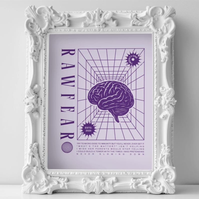 May include: A framed print with a white ornate frame. The print features a purple brain graphic, the word "RAWFEAR" in vertical text, and other text and graphics. The frame is white.
