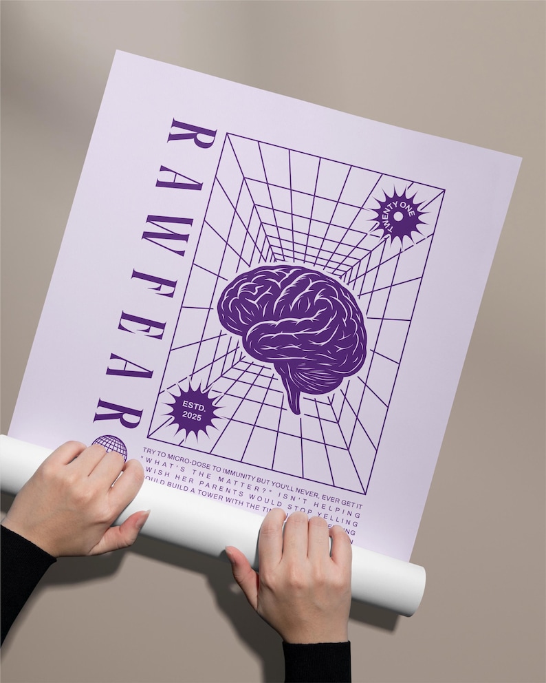 May include: A purple and white poster with the word "RAWFEAR" vertically on the left side. The poster features a brain graphic, a grid, and the text "ESTD. 2025". The poster is being held by a person.