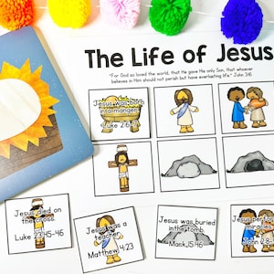 May include: A colorful educational activity set titled "The Life of Jesus." The set includes illustrated cards depicting key events from the Bible, such as Jesus' birth, death, and miracles. The text "For God so loved the world..." is also present.