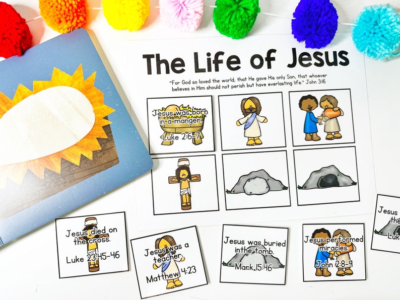 May include: A colorful educational activity set titled "The Life of Jesus." The set includes illustrated cards depicting key events from the Bible, such as Jesus' birth, death, and miracles. The text "For God so loved the world..." is also present.