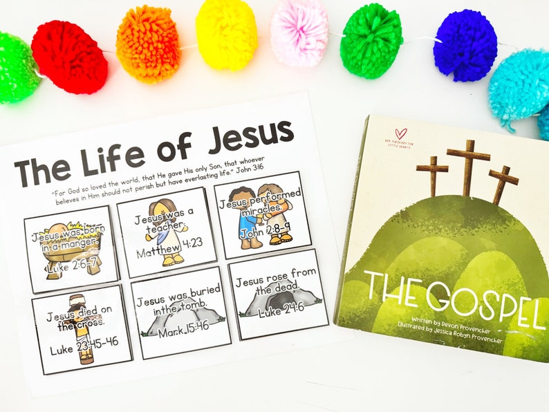 May include: A children's educational set featuring a book titled "The Gospel" and a visual aid titled "The Life of Jesus." The book cover depicts three crosses on a green hill. The visual aid includes illustrated panels with Bible verses.