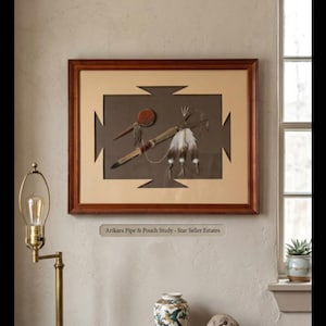 May include: A framed artwork titled "Arikara Pipe & Pouch Study" featuring Native American artifacts. The artwork includes a pipe, pouch, and feathers, set against a brown background with a tan border. The frame is dark wood.