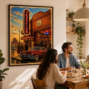 May include: A framed wall art print depicting a vintage red convertible parked in front of a brick building with a glowing neon JAZZ CLUB sign and a Route 66 shield. The scene features a sunset sky, desert rock formations, and people walking.