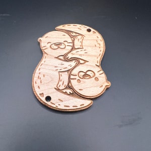 Interlocking otter keychain set