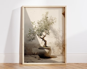May include: A framed photograph of a bonsai tree with green leaves in a terracotta pot, set against a white wall with a shadow cast on the wall.